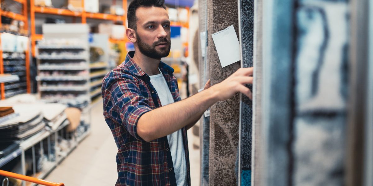 the buyer in the store chooses a carpet